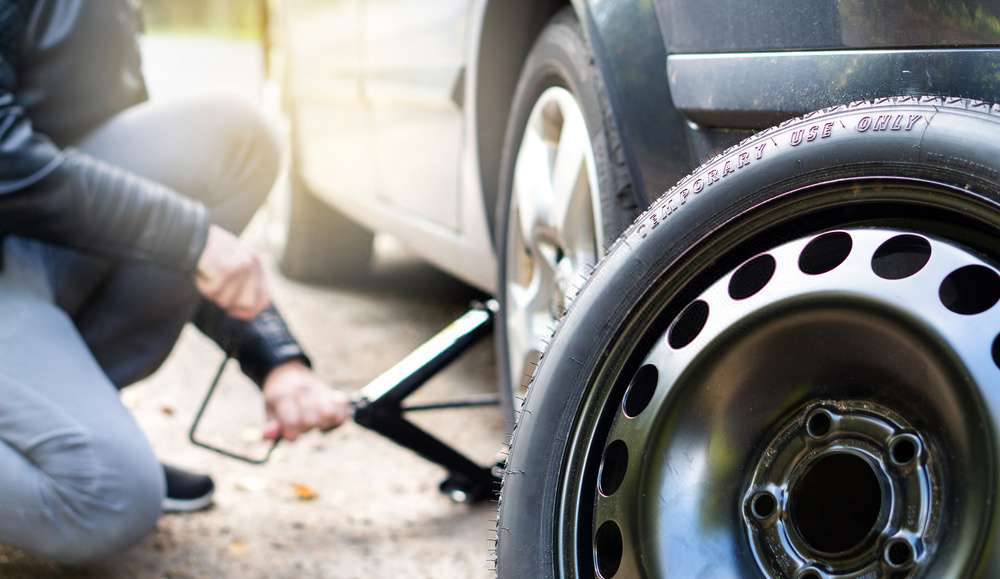 changing tyre of the car